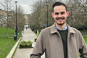 A photograph of Jacob Sinkins standing in Ropemakers Fields, Limehouse