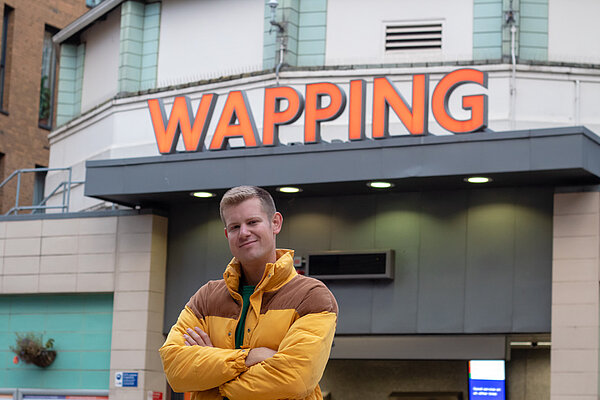 Guy standing in front of Wapping Station